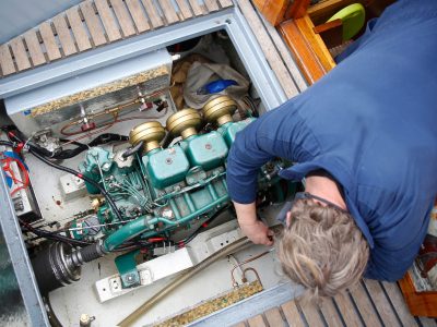 Overhead photo of man repairing a boat